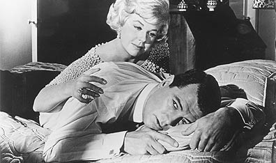 You're hiding something: Doris Day tries to figure out Rock Hudson in the 1961 film Lover Come Back. Photo Evening Standard/Getty Images.