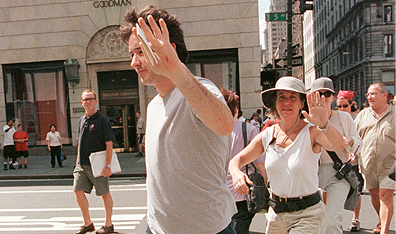 Talk to the hand: John Cusack puts the paparazzi on notice. Photo Louis Lanzano/Liaison. Getty Images.