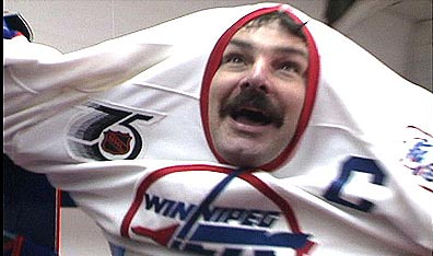 He's come undun: Burton Cummings suits up for a charity hockey game in Death by Popcorn. Courtesy l'Atelier-National du Manitoba.