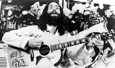 John Lennon performs at the Montreal "bed-in" in May, 1969.  Photo Keystone Features/Getty Images.John Lennon performs at the Montreal "bed-in" in May, 1969.  Photo Keystone Features/Getty Images.