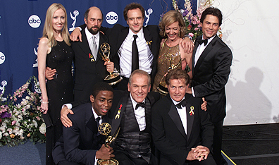 They like us, they really like us: Members of The West Wing's cast celebrate a win at the 2000 Emmy Awards. Photo Kevin Winter/Getty Images.