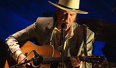 His guitar gently weeps: Neil Young performs at the Ryman Auditorium in Nashville in Neil Young: Heart of Gold. Courtesy Paramount Classics.
