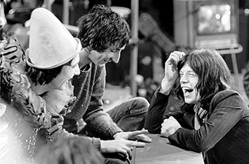 Clowning around: Who bandmembers Keith Moon (left) and Pete Townshend chat with Mick Jagger during the filming of Rock 'n' Roll Circus. (Photo Getty Images/Express/David Cairns)