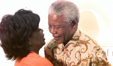 Full Nelson: Winfrey with former South African President Nelson Mandela at the Oprah Winfrey Leadership Academy for Girls in Meyerton, South Africa on Dec 6, 2002. AP Photo/Themba Hadebe.