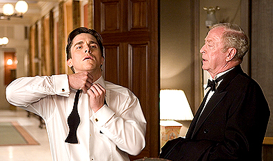 Stuffed shirt: Bruce Wayne (Bale) with loyal manservant Alfred Pennyworth (Michael Caine). Photo David James. Courtesy Warner Bros.