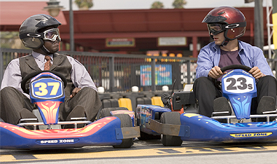 Race track: Bernie Mac (left) and Ashton Kutcher in Guess Who. Photo Claudette Barius. Courtesy Columbia Pictures/Regency Enterprises.