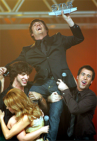 He ain't heavy: Marc-Andre Fortin is hoisted in the air after winning last season's Star Academie competition. (David Boily/Canadian Press)

