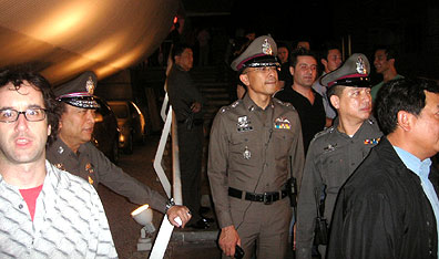 Don McKellar (left) reacts to police visit at a Bangkok nightclub. Courtesy Don McKellar.