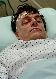 Walter Gretzky (Tom McCamus) in a coma after suffering a brain aneurism.