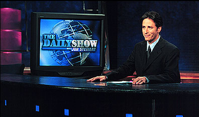 image of jon stewart at desk courtesy The Comedy Network