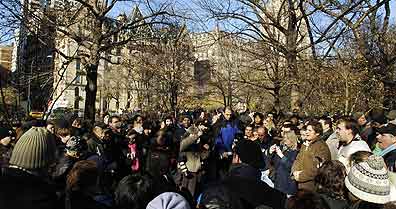 It was 25 years ago today: Fans gather and sing on the anniversary of the late Beatle John Lennon's death at the "Imagine" memorial. Photo Stan Honda/AFP/Getty Images.