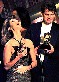 And the award for sappiest ballad goes to...: Celine Dion and David Foster, winning big at the 1997 Grammy Awards. Photo Timothy Clary/AFP/Getty Images.