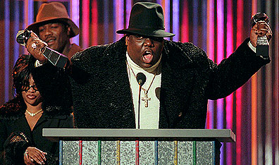 Cutline: "Y'all are invited back to my crib for Coke and Cheetos": Notorious B.I.G., winner of rap artist and rap single of the year at the Billboard Music Awards in 1995. AP Photo/Mark Lennihan.
