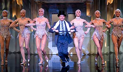 Line dancing: Leo and his "Girls With Pearls." Photo Andrew Schwartz. Courtesy Universal Studios.