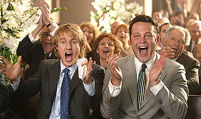 Avid churchgoers: John (Owen Wilson) and Jeremy (Vince Vaughn) celebrate yet another marriage pronouncement in Wedding Crashers. Photo Richard Cartwright. Courtesy New Line Productions.