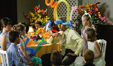 Air head: John keeps the kids occupied with his balloon whimsy. Photo Richard Cartwright. Courtesy New Line Productions.
