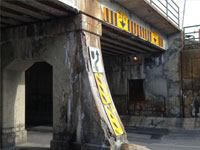 A crumbling bridge underpass